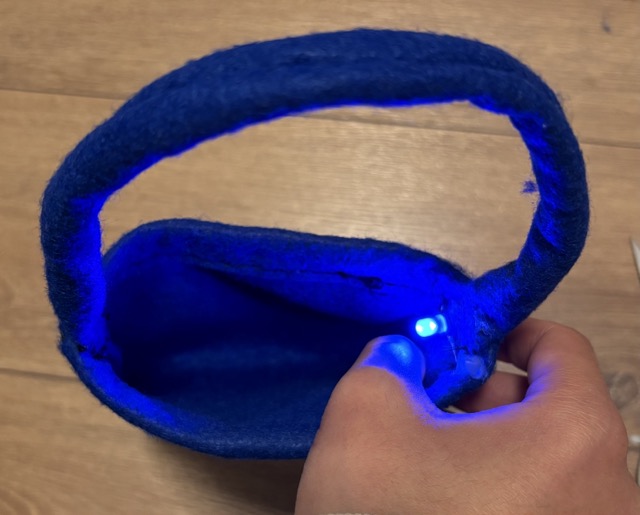 When the user wants to turn on the light they can press the pouch to close the circuit. This works because the wires inside the pouch are coiled up and small so they are not touching the battery until the pouch is pressed. 